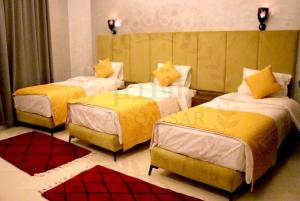 Letto o letti in una camera di Hôtel AL QAISAR