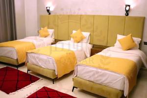 Letto o letti in una camera di Hôtel AL QAISAR