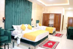 Letto o letti in una camera di Hôtel AL QAISAR