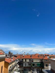 a view of the roofs of buildings in a city at Romantico Attico Cuneo in Cuneo