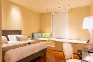 Letto o letti in una camera di Five suite