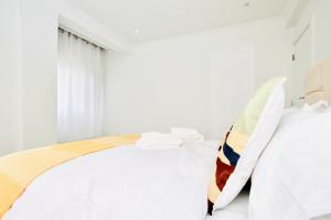 Voodi või voodid majutusasutuse Josden Residences Central Luanda toas
