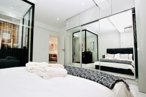 Voodi või voodid majutusasutuse Josden Residences Central Luanda toas