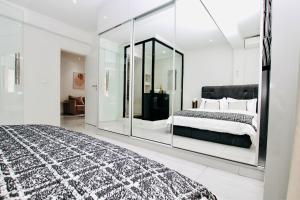 Voodi või voodid majutusasutuse Josden Residences Central Luanda toas