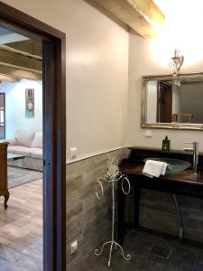 a bathroom with a sink and a mirror at Ontika Manor Unique Apartment in Ontika Asundus