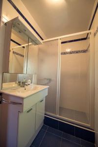 a bathroom with a sink and a shower at Apartments Villa Cardo in Mali Ston +21 photos
