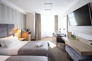 Posteľ alebo postele v izbe v ubytovaní Hotel Kopczyński