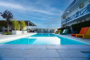 a swimming pool in front of a building at White Vama Veche in Vama Veche +26 photos