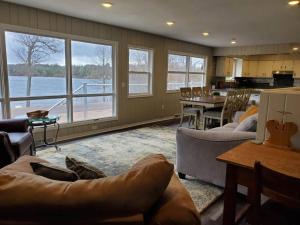 a large living room with a view of the water at Starry Night in Danbury