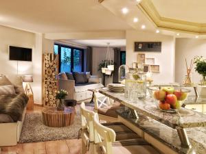a living room with a table with fruits on it at Deluxe - Le millésime - Calme in Strasbourg