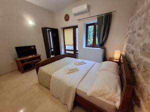 Filip Deluxe Rooms客房内的一张或多张床位