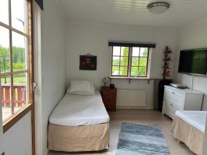 Ένα ή περισσότερα κρεβάτια σε δωμάτιο στο Charmiga Norrangen