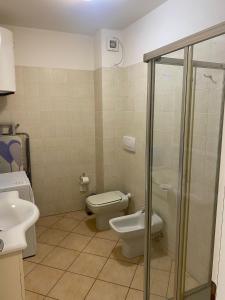 a bathroom with a toilet and a sink at Oasi Verde 1 in Lerici