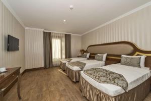A bed or beds in a room at The Central Hotel