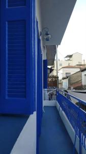 a blue door on the side of a balcony at Χαβίνη 35 in Amfilochía