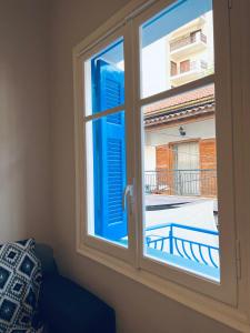 a window with a view of a balcony at Χαβίνη 35 in Amfilochía