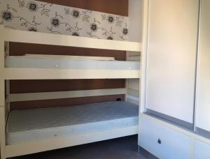 Ένα ή περισσότερα κρεβάτια σε δωμάτιο στο CittaNova Centre appartment