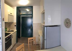 Η κουζίνα ή μικρή κουζίνα στο CittaNova Centre appartment +7 φωτογραφίες