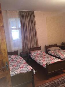 Postel nebo postele na pokoji v ubytování Guesthouse Robinzon Lalkhori