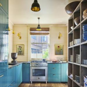 a kitchen with blue cabinets and a stove at New perfect home. in Koprivshtitsa