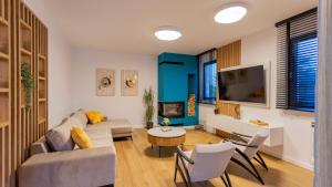 a living room with a couch and a table at Villa Decima near Split - Heated Pool, Tennis Court & Billiards in Dicmo