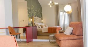 a living room with a bed and a couch at Villa Decima near Split - Heated Pool, Tennis Court & Billiards in Dicmo +56 photos