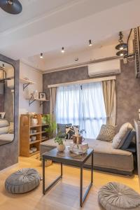 a living room with a couch and a table at 2 巣鴨駅5分 5人房 1LDK 便利热闹丨Sugamo JR Line 5 minutes 5people in Tokyo