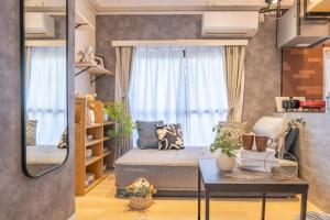 a small living room with a bed and a table at 2 巣鴨駅5分 5人房 1LDK 便利热闹丨Sugamo JR Line 5 minutes 5people in Tokyo