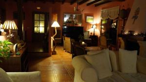 a living room with a couch and a table at El Balcón De Alboreca in Sigüenza