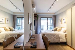 Cama ou camas em um quarto em 360 Ambience Vila Mariana