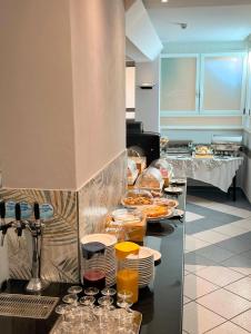 a buffet line in a restaurant with plates of food at Dipendenza BeB Villa Denny in Rimini