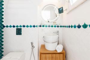 a bathroom with a sink and a mirror at Villa Nannina in Positano