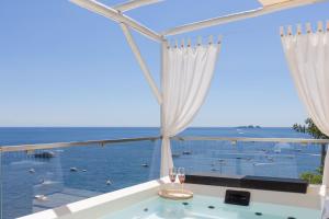 a bath tub with a view of the ocean at Villa Nannina in Positano