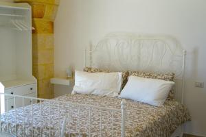 Postel nebo postele na pokoji v ubytování Masseria Fra Telesforo + 37 fotografií