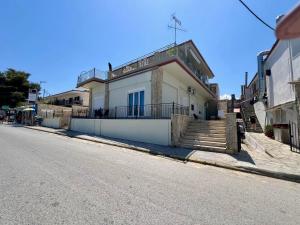 a house on the side of a street at mySIVIRI in Siviri