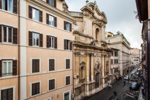 an old building on a street in a city at Impero Vaticano Navona Apartment in Rome