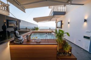 a room with a swimming pool in a house at Mato Luxury Apartments in Sarandë
