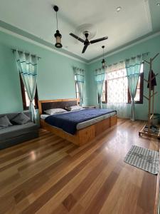 Letto o letti in una camera di John's Homestay