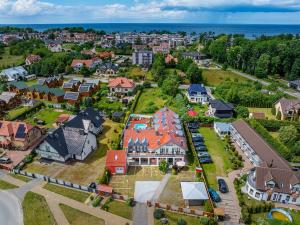 an aerial view of a residential neighborhood with houses at FRAJDA Dom Wypoczynkowy in Rewal