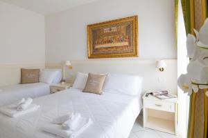 Cama ou camas em um quarto em Hotel Negresco
