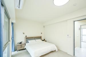Letto o letti in una camera di Douhao B&B
