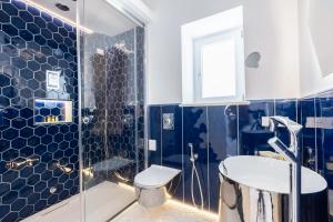 a bathroom with a shower and a toilet and a sink at Villa Nannina in Positano