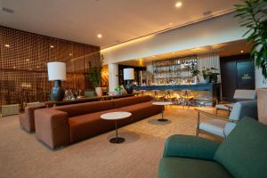 Uma área de estar em Monã Hotel