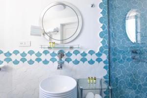a bathroom with a toilet and a mirror at Villa Nannina in Positano