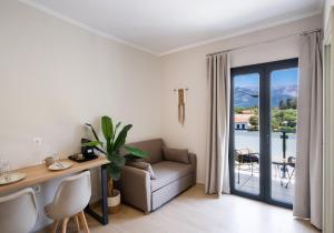 a living room with a couch and a table at Baron Suites in Vasiliki