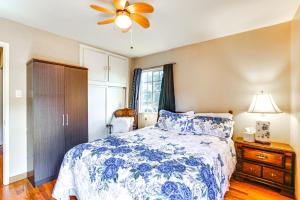 a bedroom with a blue and white bed and a ceiling fan at Dog-Friendly California Home with Patio, Near Hiking in La Mesa