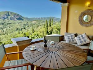 a wooden table in a room with a view at Sea View Villa - Close from Beach - Rovinia in Liapades