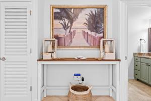 a shelf in a room with a picture of a pier at Jade East Towers 1550 by Newman-Dailey in Destin