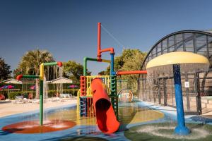 a water park with a playground with a slide at Mer et Soleil 5 étoiles à Oléron empl 170 3CH 1SDB 8 personnes in Les Sables Vignier