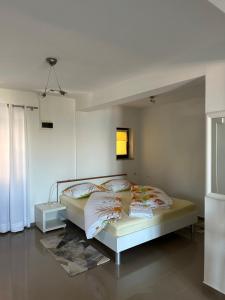 Ein Bett oder Betten in einem Zimmer der Unterkunft Villa Beba - Apartments